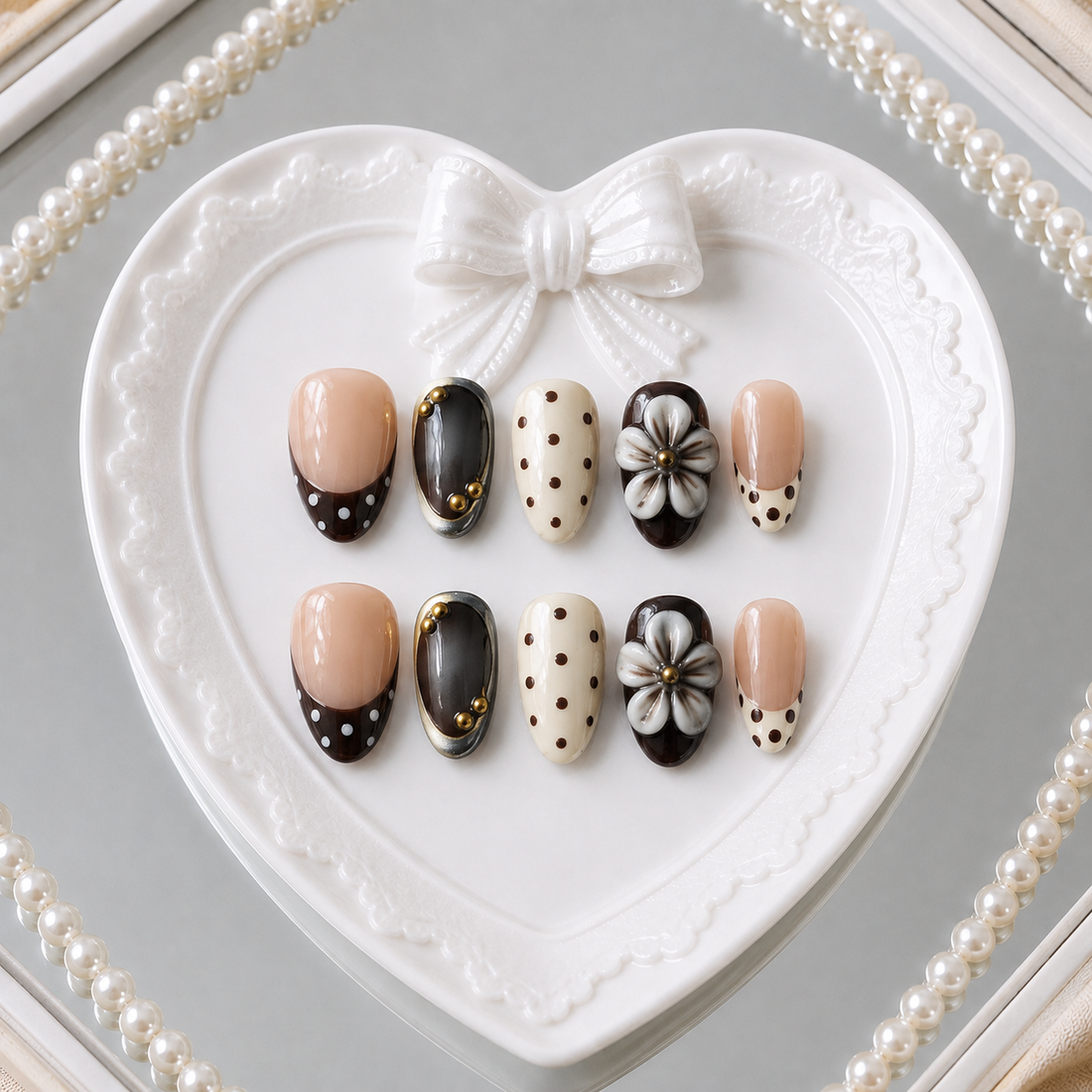 Cocoa Camellia press-on nail set in a pearl heart mirror setting