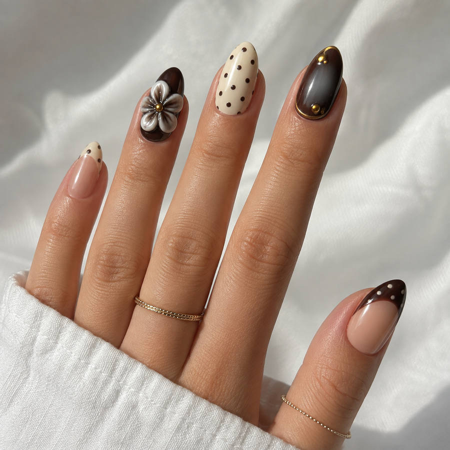Cocoa Camellia short almond press-on nails on a ring hand